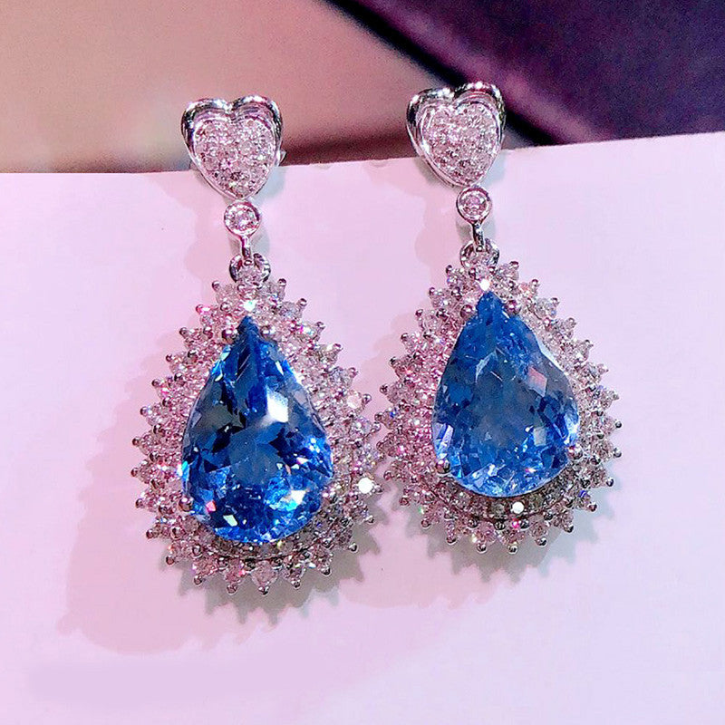 Silver Plated American Diamond Studded Blue Teardop Shape Ice Cut Drop Earrings